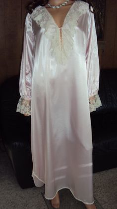 This is a vintage 60's JENELLE OF CALIFORNIA Pink Wet Looking satin polyester with Alcorn Lacing Long / Tall Nightgown size Medium / Large / XL . The nightgown size tag is faded but by it's style & measurements will fit some size Medium's , size Large's & some size X Large's thus my listing . See measurements for proper fitting . It is in very good vintage condition . The nightgown comes with wide front V neck & upper back Alcorn lacing ( see pics ) , wide laced Elastic banded sleeve cuffs (  se Vintage Dresses For Pajama Party, Vintage Long Sleeve Nightgown For Pajama Party, Vintage Nightgown For Wedding Night, Vintage Wedding Nightgown, Vintage Lace Trim Sleepwear For Pajama Party, Vintage Long Sleeve Nightgown For Sleep, Vintage Long Sleeve Nightgown For Home, Retro Lace Trim Nightgown For Sleep, Edwardian Nightgown