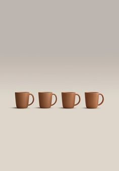 three coffee cups lined up in a row