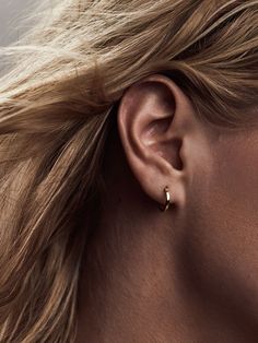 These super dainty hoop earrings hug your ear lobe for a subtle, barely-there look. SMALL: Outer diameter: 1cm (10 mm) Inner diameter: 0.7cm (7mm) *Fits most ear lobes, and is great for cartilage piercings. Model pictured is wearing a small hoop. MEDIUM: Outer Diameter: 1.2 cm (12cm) Inner Diameter: 0.9cm (9cm) *For lobes that are a bit thicker, ears that have a higher set piercing on the lobes or if you want to have a bit more space between the lobe and the hoop. Earrings are made of gold-plate Ear Huggies, Ruby Earrings Studs, Small Gold Hoop Earrings, Cartilage Piercings, Gold Bar Earrings, Dainty Hoop Earrings, Cleaning Silver Jewelry, Emerald Earrings Studs, Silver Jewellery Indian