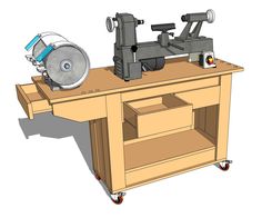 a table sawing machine on top of a workbench with drawers underneath it