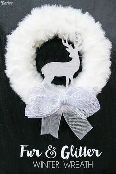 a white wreath with a deer on it and the words fur & glitter winter wreath