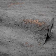 a roll of tape sitting on top of a concrete floor