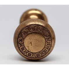 an antique brass door knob with ornate designs