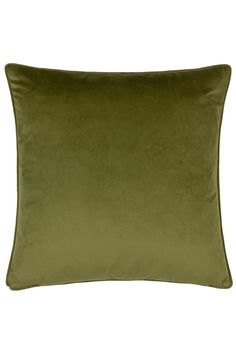 a green velvet pillow on a white background