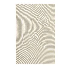 a beige and white rug with wavy lines in the shape of a spiral design on it