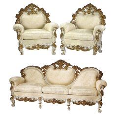 an ornately decorated couch and two chairs with gold trimmings on white background