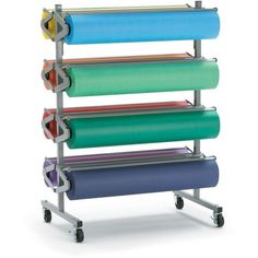 a multicolored rolling rack holds several rolls of paper and other items on wheels