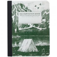 a green notebook with a tent on the cover and mountains in the background that reads, decomposition book