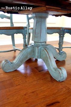 an old table and chairs are painted blue