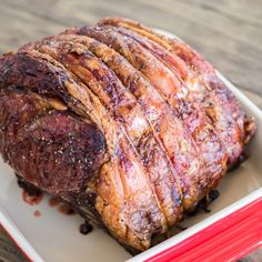 a large piece of meat sitting on top of a white plate