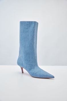 For Spring/Summer 2024, Amina Muaddi played with the idea of trompe l'œil by crafting a pair of thigh-high suede boots with a denim print. Spring Denim Knee-high Boots, Spring Knee-high Denim Boots, Denim Knee-high Boots For Spring, Fitted Denim Blue Boots For Fall, Denim Summer Boots, Fitted Denim Summer Boots, Fitted Denim Boots For Summer, Trendy Fitted Denim Blue Boots, Fitted Denim Boots With Pointed Toe