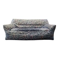 an upholstered couch is shown on a white background with the fabric pulled back