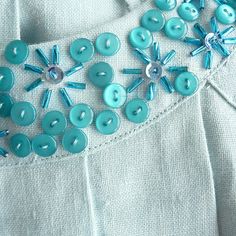 a close up of buttons on a piece of cloth