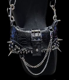 Edgy Rectangular Shoulder Bag For Party, Black Punk Evening Bags, Black Punk Style Evening Bags, Edgy Black Bag With Chain Detail, Black Party Bag With Hardware Details, Black Party Bag With Hardware, Edgy Shoulder Bag With Rivets For Concerts, Black Gothic Shoulder Bag With Rivets, Gothic Black Shoulder Bag With Rivets