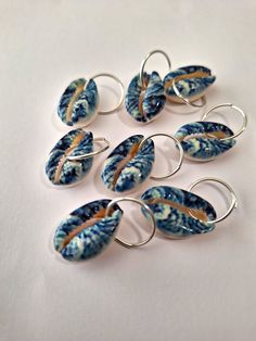 Set of 8 loc rings made with hand painted cowrie shells on stainless steel rings.  Rings open to fit all locs and braids. Unique Hand-painted Jewelry For Beach, Unique Hand Painted Jewelry For Beach, Loc Rings, Afro Jewelry, Creative Things To Make, Braid Rings, Dreadlock Jewelry, Dope Jewelry Accessories, Hair Charms