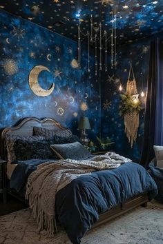 a bedroom decorated in blue and gold with stars on the ceiling