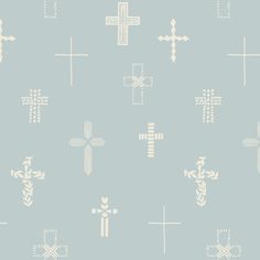 a blue and white wallpaper with crosses on it