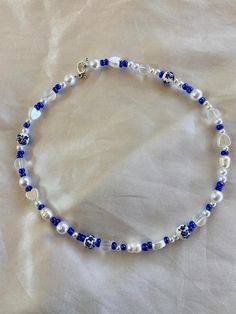 This beautiful blue beaded necklace is made with a variety of different types beads! No specific pattern so each necklace is different! This necklace is 15 inches long! Happy shopping Blue Bohemian Pearl Necklace For Gift, Bohemian Blue Heart Beads, Blue Oval Beads Necklaces For Jewelry Making, Blue Beaded Necklace With Colorful Beads As Gift, Blue Bohemian Beaded Necklace With Heart Beads, Blue Beaded Necklaces With Oval Beads, Blue Oval Bead Necklaces, Adjustable Blue Beaded Necklace With Heart Beads, Blue Beaded Oval Necklaces