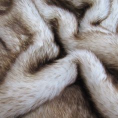 an animal fur texture is shown in grey and white