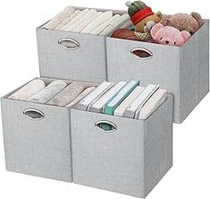 three storage bins with stuffed animals and books in them on top of each other