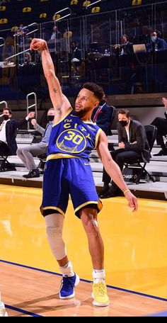 a basketball player is about to dunk the ball