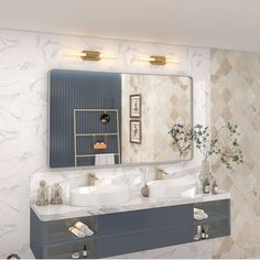 a bathroom with two sinks and a mirror on the wall next to it is decorated in marble