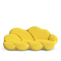 a yellow couch sitting on top of a white floor