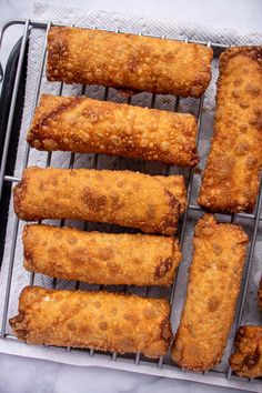 some fried food is sitting on a cooling rack and ready to be cooked in the oven