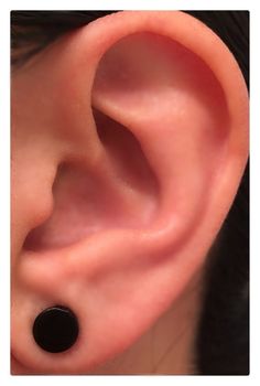 an ear with a black dot on it