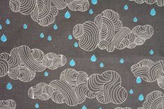 a black and white pattern with blue raindrops