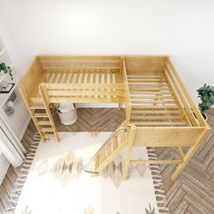 two wooden bunk beds sitting next to each other on top of a white and wood floor