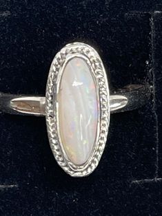 Stunning Opal ring size 9 in .999 fine silver and .925 sterling silver. October birthstone Elegant Silver Opal Stackable Rings, Silver Cabochon Rings Fine Jewelry, Classic Sterling Silver Jewelry With Stone Setting, Silver Sterling Silver Moonstone Ring, Silver Sterling Moonstone Ring Fine Jewelry, White Gold Moonstone Ring Stamped 925, Fine Jewelry Silver Moonstone Ring In Sterling Silver, Formal Silver Sterling Silver Moonstone Ring, Silver Cabochon Rings For Anniversary