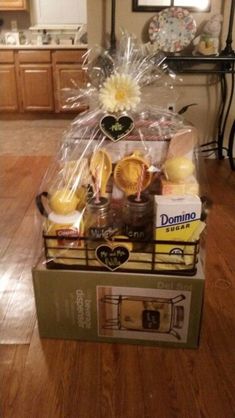 a box filled with food sitting on top of a wooden floor