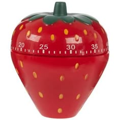 a red strawberry shaped thermometer with yellow dots