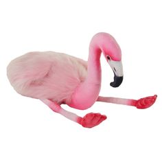 a pink flamingo stuffed animal sitting on top of a white floor