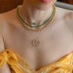 14k Yellow Gold Pave-set emeralds give this chain necklace a touch of brilliance. Chain is 14-16-18" in length. Care tips: It will not oxidize or discolor. But since gold is a very soft metal that scratches easily, give it a wipe with a jewelry cloth once and awhile to keep it fresh. Heart Choker Necklace, Brand Magazine, Heart Choker, Zodiac Gifts, Artisan Gift, Zodiac Jewelry, Green Emerald, Pure Gold, Handmade Artisan