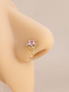 a close up view of a fake breast with a ring on it's side