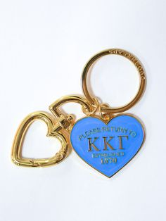 a blue heart shaped keychain with the words please return to kkt on it