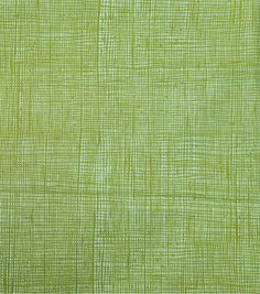 a green cloth textured with small squares and lines, as well as the background