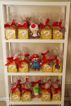 shelves filled with different types of toys and boxes on top of each shelf, all labeled with question marks