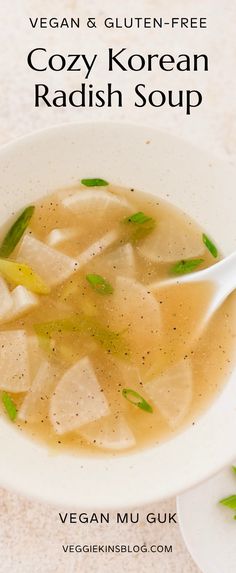 a white bowl filled with soup on top of a table