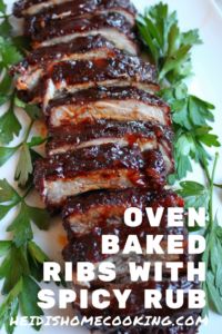 ribs with spicy rubs on a white plate and garnished with parsley