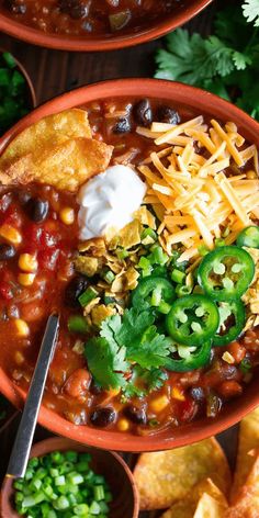 two bowls filled with taco soup and tortilla chips