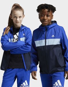 Keep this juniors' adidas windbreaker in your bag and stay prepared for whatever the weather throws at you. This lightweight jacket is lined for comfort and fitted with a hood to shelter you from the rain. WIND.RDY technology blocks out gusts and reflective details increase your visibility so you can venture outdoors with confidence. This product is made with 100% recycled materials. By reusing materials that have already been created, adidas help to reduce waste and our reliance on finite resources and reduce the footprint of the products adidas make.• This model is 152 cm and wears a size 11-12Y. Their chest measures 70 cm and the waist 60 cm.• Regular fit• Full zip with hood• 100% polyester (recycled)• Mesh lining• WIND.RDY• Front zip pockets• 360 reflectivity• Packable into side pocket Adidas Windbreaker, Student Discounts, Reduce Waste, Jd Sports, Blue Adidas, Blue Jacket, Lightweight Jacket, Side Pocket, The Rain