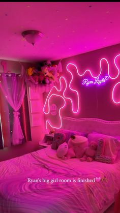 a bed room with a neatly made bed and neon lights