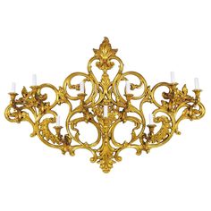 A large this antique style nine-light wall sconce will be a graceful focal point on any wall. Modern materials with old-world charm of Louis XV style. Beautiful gilt piece features elaborate scrolls, foliate design and floral accents. At its centre it swells out, allowing for greater dimension and interest. Affixed with corded wall plug. Made of durable molded plastic. Great condition. American, contemporary Size: H. 30", W. 45", D. 8". Art 101, Baroque Frames, Style Royal, Baroque Pattern, Baroque Design, Beauty Beast, Wood Model, Light Decor, Wall Plug