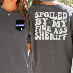 Sheriff Wife Comfort Colors T-shirt is the perfect custom gift for a sheriff's wife or wife to be!  In the personalization box, enter the name or number you want on the front pocket of your shirt. (Ex: 3602 OR Jackson) This shirt runs true to size.  If you want an oversized look, please order one size up.  If you want the oversized dress look, please size up two sizes. This is made with a 1717 Comfort Colors, garment-dyed t-shirt. Made with 100% ring-spun cotton, soft-washed, and garment-dyed fa Police Officer Girlfriend, Police Girlfriend, Cop Wife, Police Wife Shirt, Deputy Wife, Police Officer Wife, Leo Wife, Police Shirts, Police Gifts