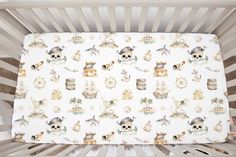 a crib sheet with an animal theme on it