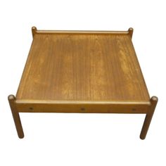 a wooden table with two legs and a small tray on it's side, against a white background