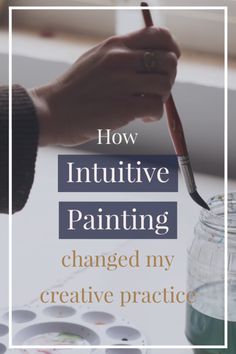 a person holding a paintbrush in their hand with the words how intuitive painting changed my creative practice